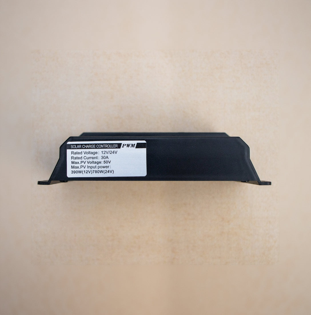 Black solar charge controller with label on a beige background