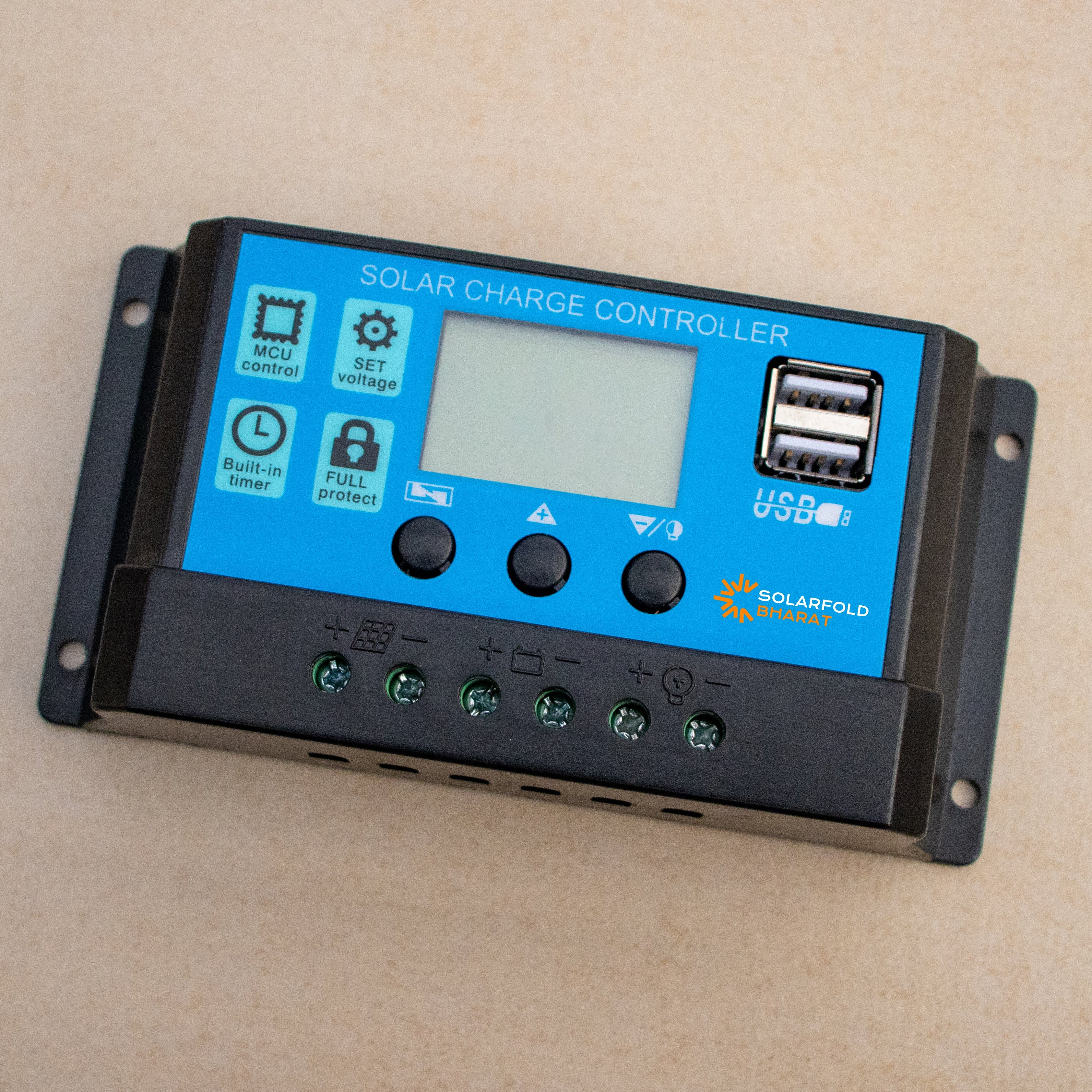 Solar charge controller with blue display on a beige background