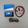 Solar charge controller with cables and packaging on a gray surface